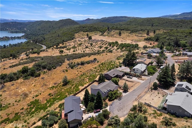 aerial view featuring a water and mountain view and a residential view