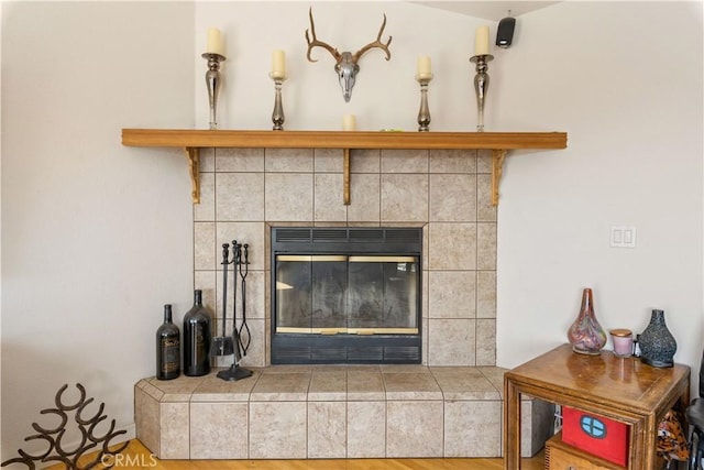 room details with a glass covered fireplace