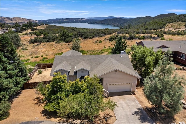 birds eye view of property featuring a water and mountain view