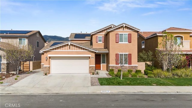 17938 Caraway Ct, San Bernardino, CA 92407 - craftsman-style home featuring stucco siding, driveway, an attached garage, solar panels, and fence