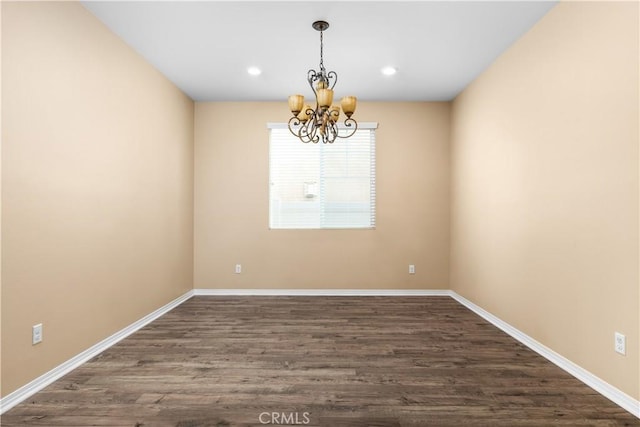 17938 Caraway Ct, San Bernardino, CA 92407 - empty room with dark wood-style flooring, baseboards, recessed lighting, and a notable chandelier