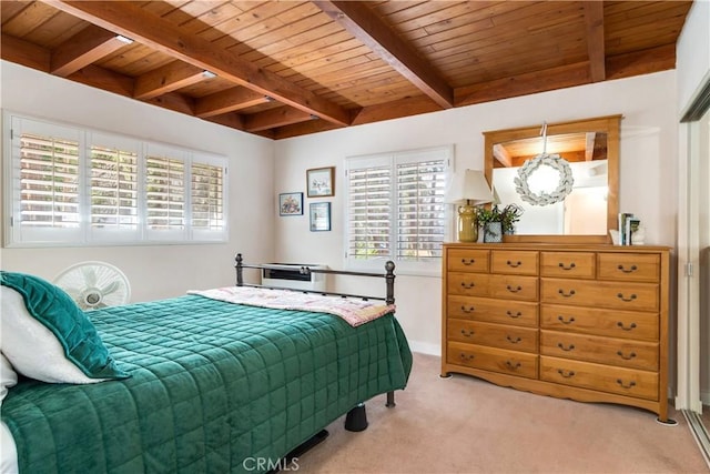 carpeted bedroom featuring wood ceiling and beam ceiling