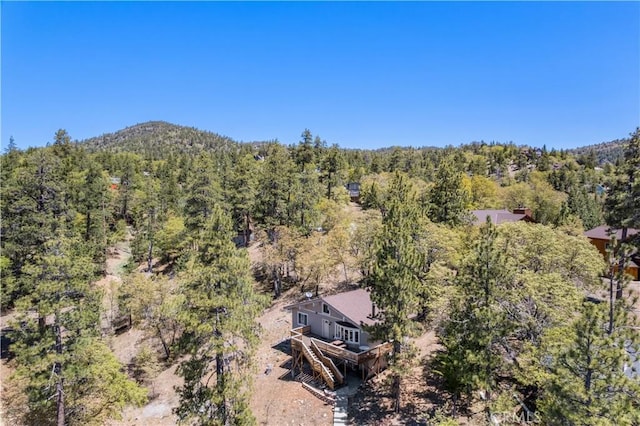 drone / aerial view with a view of trees