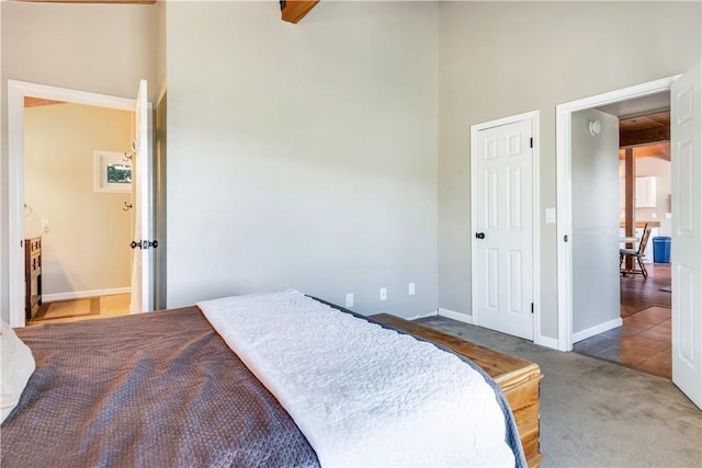 carpeted bedroom with baseboards