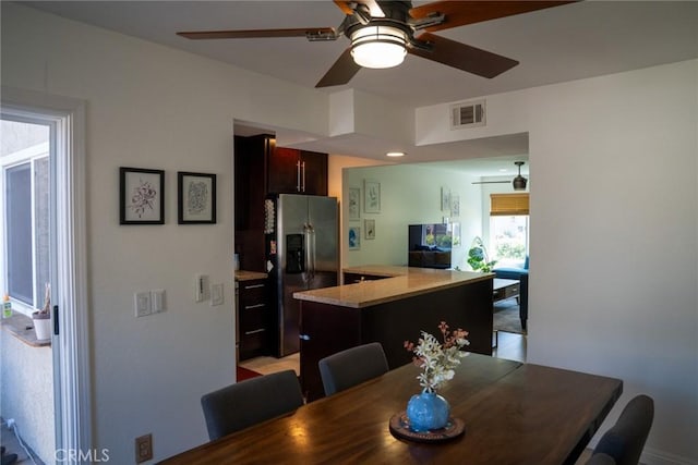 dining space featuring visible vents and ceiling fan