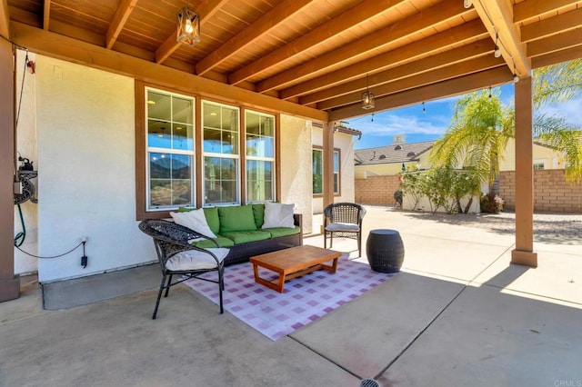 view of patio / terrace featuring fence and an outdoor hangout area