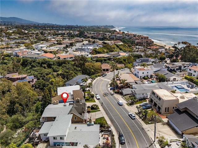 drone / aerial view with a water view and a residential view