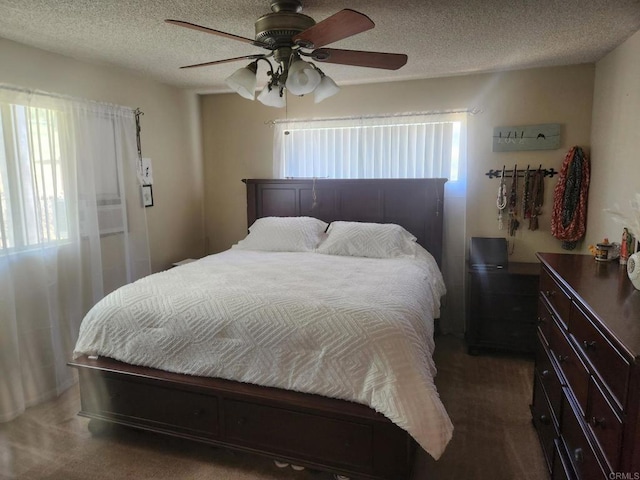 bedroom featuring a ceiling fan and a textured ceiling