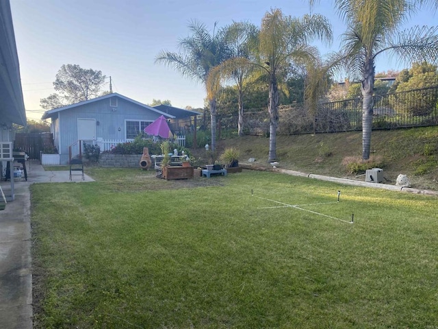 view of yard with fence and a patio area