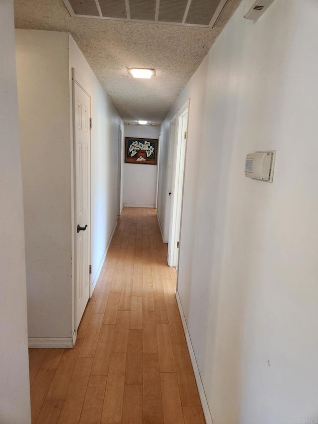 554 Taylor St, Vista, CA 92084 - corridor featuring light wood-style flooring and a textured ceiling