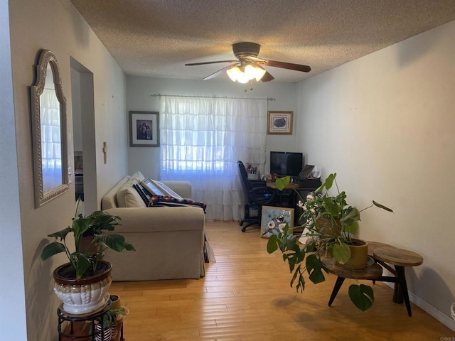 554 Taylor St, Vista, CA 92084 - living room featuring a desk, ceiling fan, wood-type flooring, and a textured ceiling