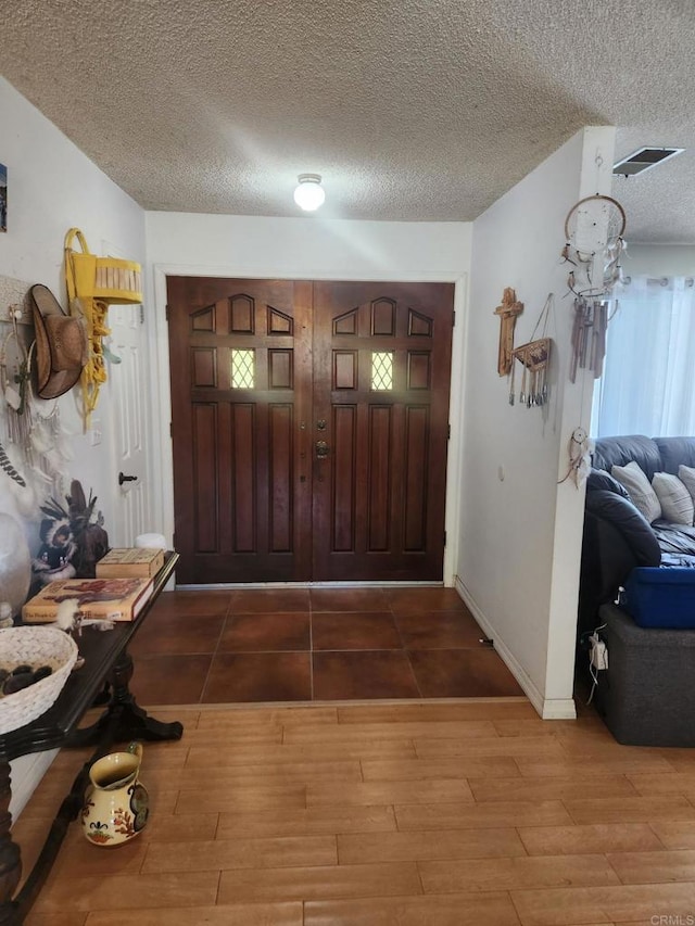 554 Taylor St, Vista, CA 92084 - foyer with wood finished floors and a textured ceiling