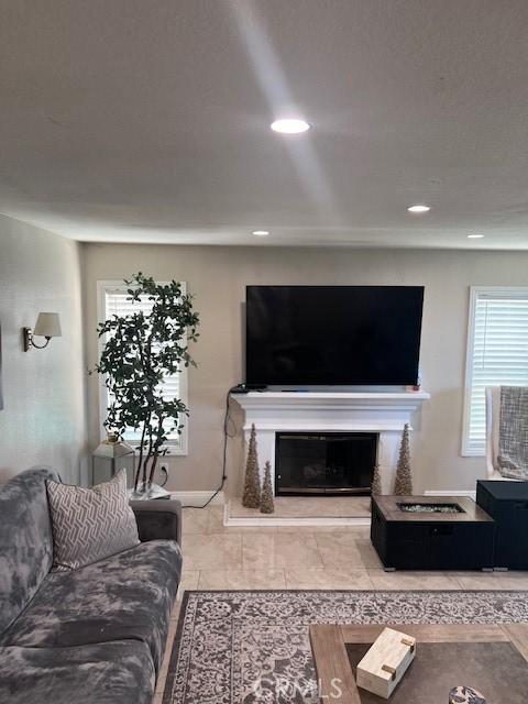 2899 Amber Dr, Corona, CA 92882 - living room featuring a high end fireplace and recessed lighting