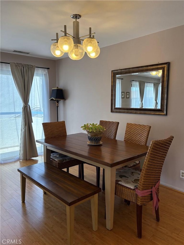 100 N Electric Ave Unit 5, Alhambra, CA 91801 - dining room with light wood-type flooring and a chandelier