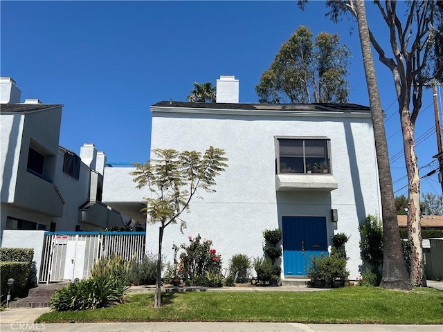 100 N Electric Ave Unit 5, Alhambra, CA 91801 - view of front of house with stucco siding and a chimney
