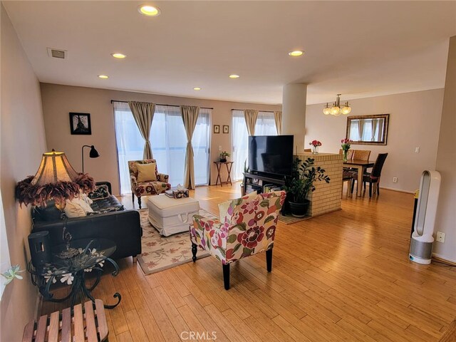 100 N Electric Ave Unit 5, Alhambra, CA 91801 - living area featuring healthy amount of natural light, a chandelier, light wood-style floors, recessed lighting, and baseboards