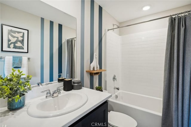 bathroom featuring toilet, wallpapered walls, vanity, and shower / tub combo with curtain