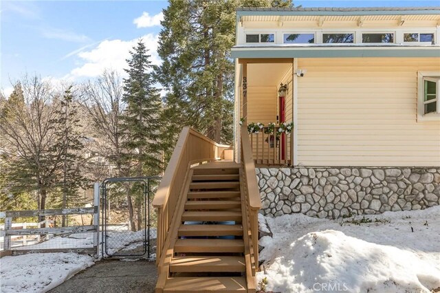 337 Lookout Dr, Twin Peaks, CA 92391 - snow covered property entrance with fence and a gate