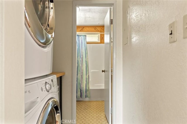 337 Lookout Dr, Twin Peaks, CA 92391 - washroom featuring stacked washing maching and dryer, laundry area, and a textured ceiling