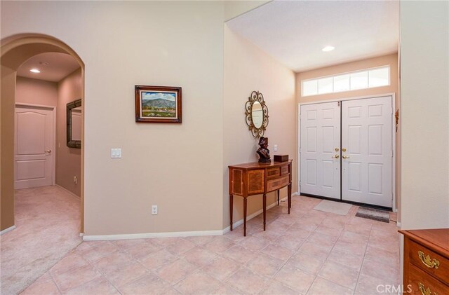 24182 Via Llano, Murrieta, CA 92562 - entryway featuring arched walkways, baseboards, and recessed lighting