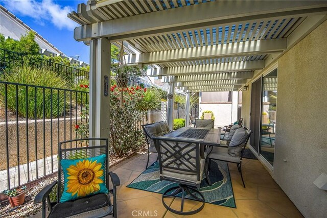 24182 Via Llano, Murrieta, CA 92562 - view of patio / terrace featuring outdoor dining area, a fenced backyard, and a pergola