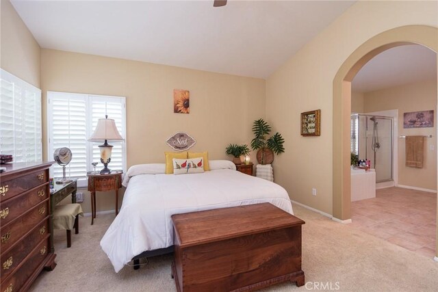 24182 Via Llano, Murrieta, CA 92562 - bedroom featuring arched walkways, light carpet, baseboards, and a ceiling fan
