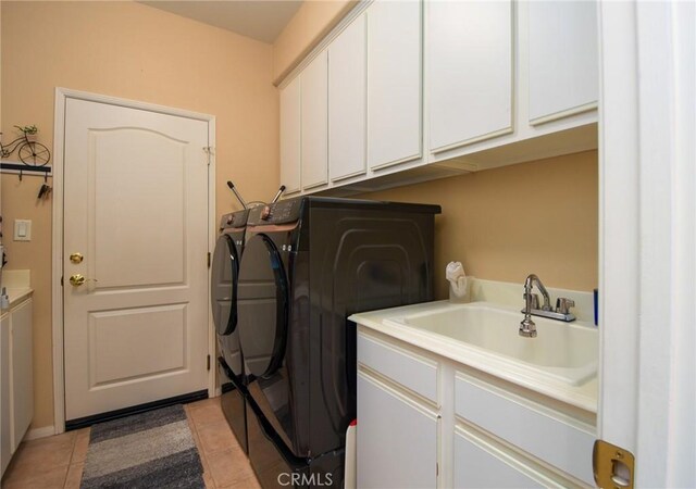 24182 Via Llano, Murrieta, CA 92562 - washroom featuring independent washer and dryer, cabinet space, and light tile patterned flooring