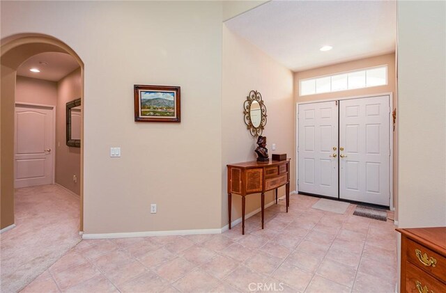 24182 Via Llano, Murrieta, CA 92562 - entrance foyer with arched walkways, baseboards, and recessed lighting
