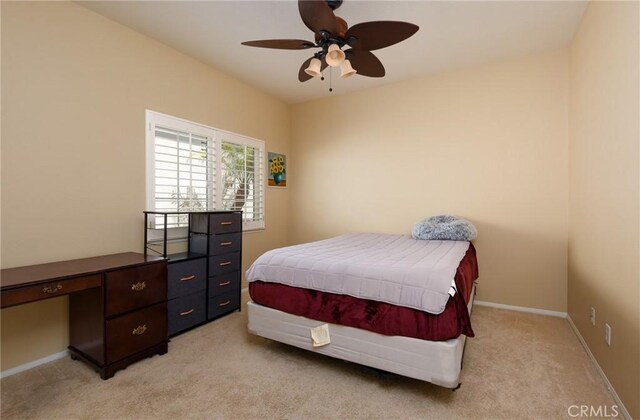 24182 Via Llano, Murrieta, CA 92562 - bedroom with light carpet, baseboards, a desk, and a ceiling fan