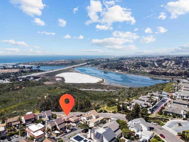 birds eye view of property with a residential view and a water view