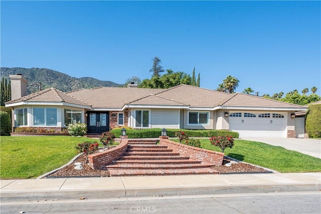 351 W Northridge Ave, Glendora, CA 91741 - single story home featuring a chimney, driveway, an attached garage, a front lawn, and a tiled roof