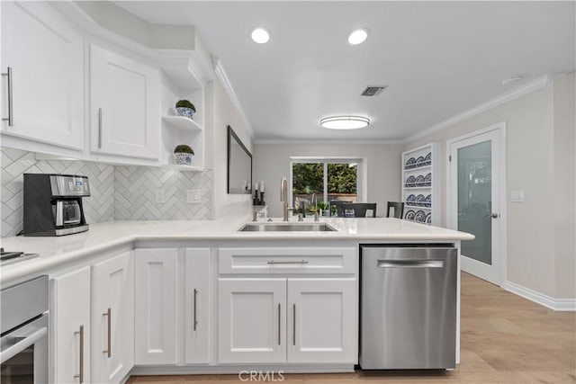 351 W Northridge Ave, Glendora, CA 91741 - kitchen with crown molding, a peninsula, white cabinets, a sink, and stainless steel appliances