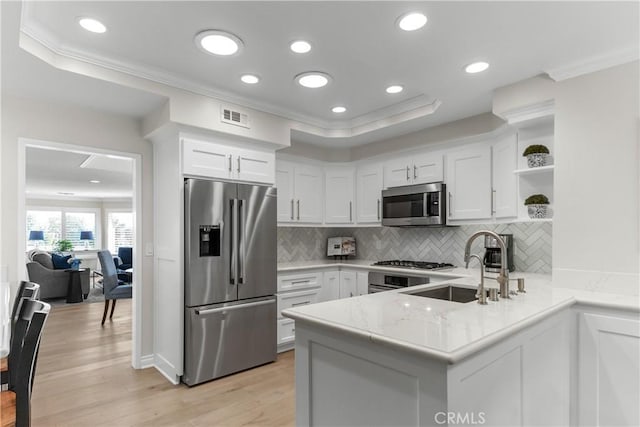 351 W Northridge Ave, Glendora, CA 91741 - kitchen featuring crown molding, a peninsula, appliances with stainless steel finishes, and a sink