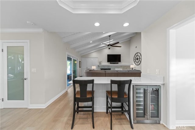 351 W Northridge Ave, Glendora, CA 91741 - kitchen featuring light wood-type flooring, a peninsula, a ceiling fan, beverage cooler, and vaulted ceiling with beams