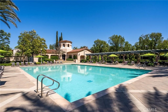 community pool with a patio area