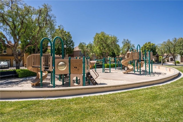 communal playground featuring a lawn