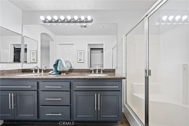 full bathroom with a sink and a stall shower