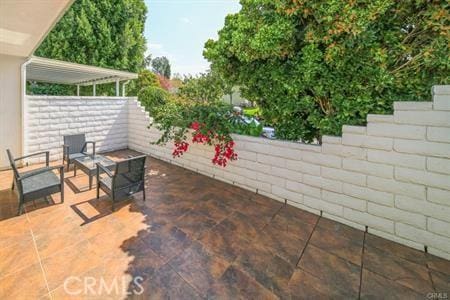 2019 Via Mariposa W Unit G, Laguna Woods, CA 92637 - view of patio / terrace with fence