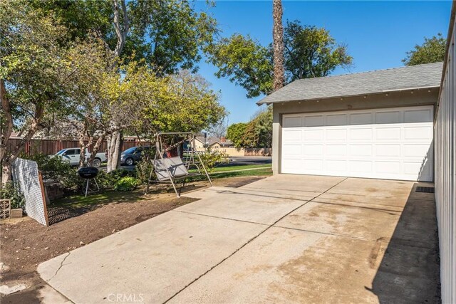 detached garage with fence