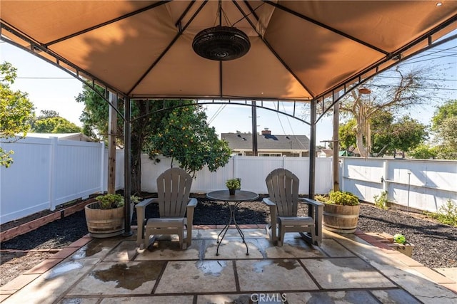 view of patio / terrace featuring a fenced backyard and a gazebo