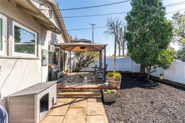 view of patio / terrace featuring a gazebo and a fenced backyard