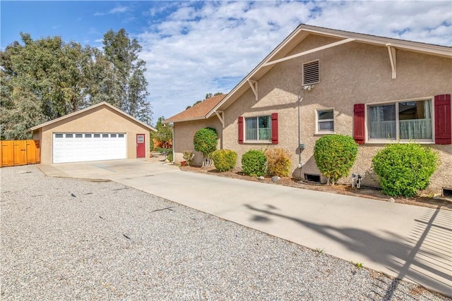 250 N Wateka St, San Jacinto, CA 92583 - view of front of property featuring stucco siding, a garage, and an outdoor structure