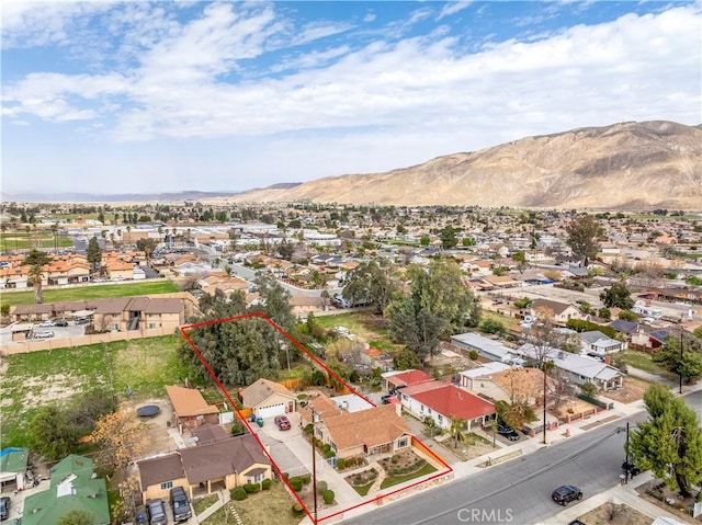 250 N Wateka St, San Jacinto, CA 92583 - aerial view of residential area featuring property boundaries highlighted and a mountain backdrop