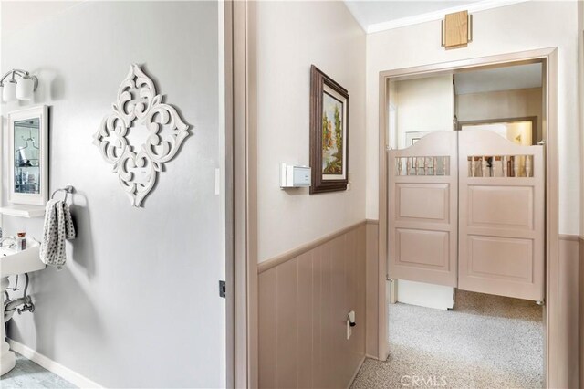 250 N Wateka St, San Jacinto, CA 92583 - hallway featuring a wainscoted wall and light colored carpet