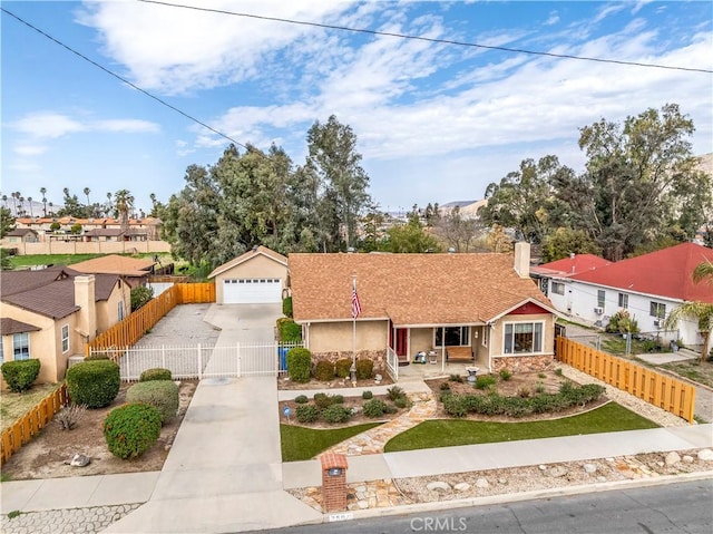 250 N Wateka St, San Jacinto, CA 92583 - view of front of house featuring a gate, a detached garage, stucco siding, a residential view, and covered porch