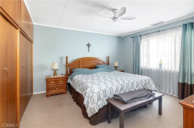 250 N Wateka St, San Jacinto, CA 92583 - bedroom with light colored carpet, a closet, crown molding, a ceiling fan, and baseboards