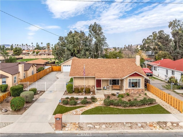 250 N Wateka St, San Jacinto, CA 92583 - ranch-style home with a gate, stucco siding, a residential view, a detached garage, and covered porch