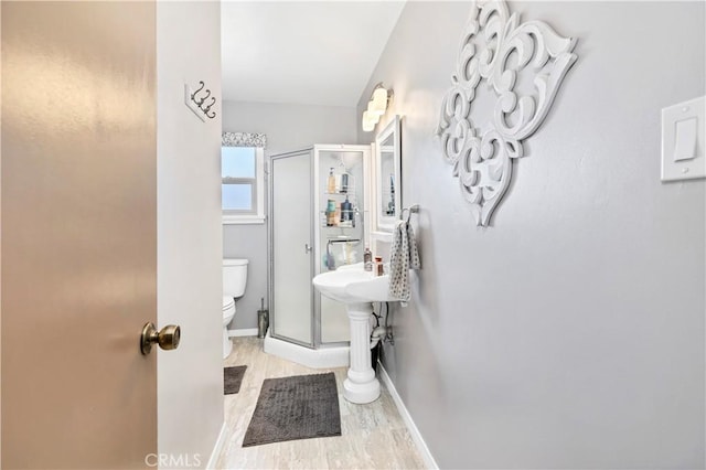 250 N Wateka St, San Jacinto, CA 92583 - bathroom featuring a stall shower, toilet, and baseboards