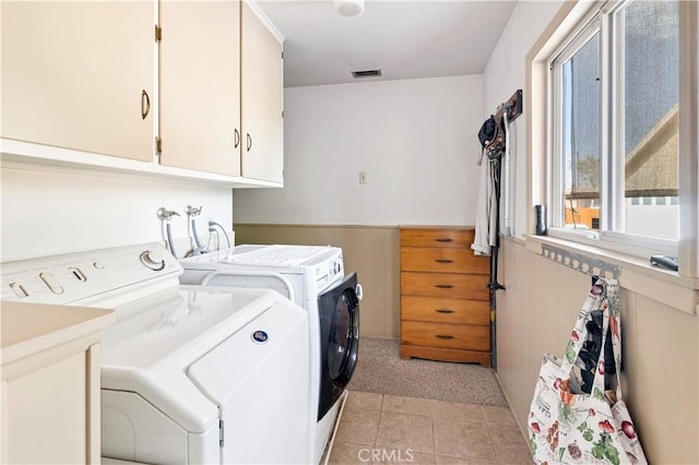 250 N Wateka St, San Jacinto, CA 92583 - washroom featuring washer and clothes dryer, cabinet space, light tile patterned flooring, a wainscoted wall, and light carpet