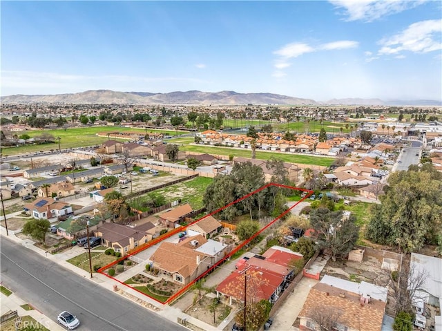 250 N Wateka St, San Jacinto, CA 92583 - aerial perspective of suburban area with a mountain backdrop and property parcel outlined